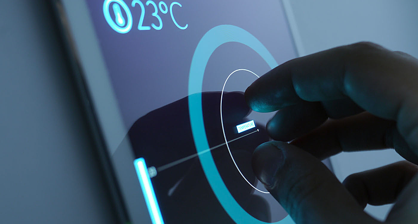 A person tuning the temperature in his home via the app